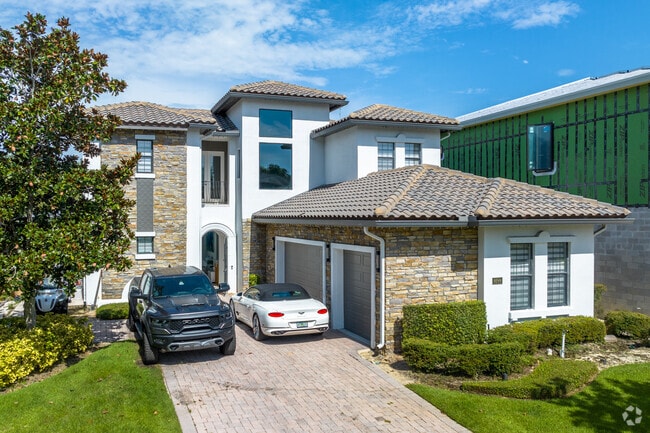 Mediterranean-style home with modern flair in the Champions Gate neighborhood.