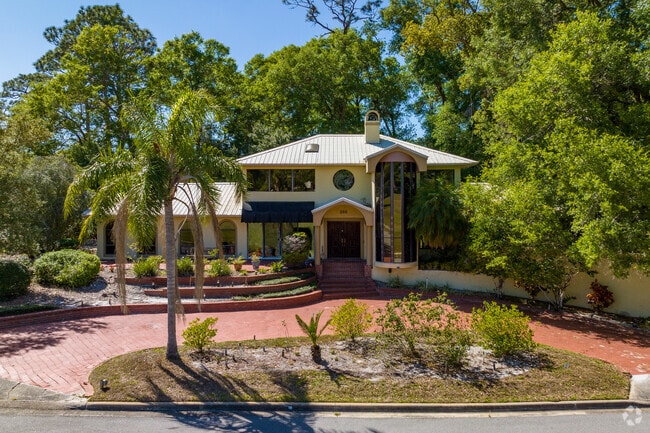 Florida style home surrounded by lush greenery in Longwood.