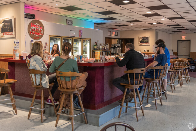 Have a drink with friends at Doc's Bar & Restaurant in Harvest Moon Bowling Lanes in Woodward.