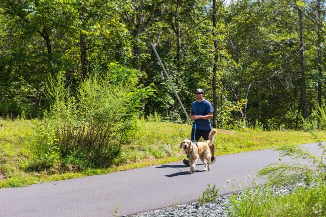 Foster residents enjoy paved paths for walking dogs and outdoor strolls.