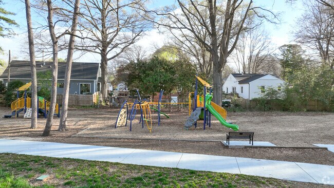 Children play at the Enderly Park playground, a popular feature of the neighborhood park.