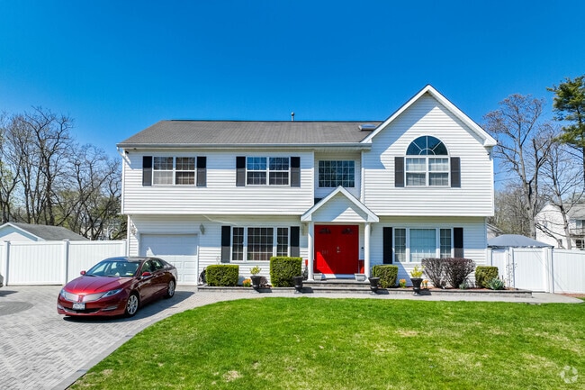 This bi-level in North Bay Shore is perfectly landscaped.
