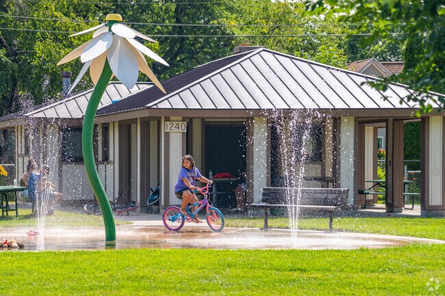 A young Green Bay resident enjoys the splash pad in Wisconsin's Eastman Park.