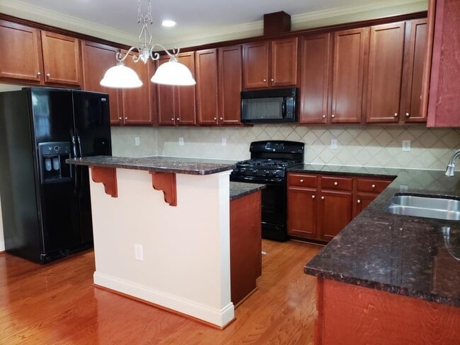 kitchen with granite and full appliances
