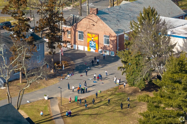 Children at play outdoors on a winters day at Koinonia Academy, Plainfield, NJ.