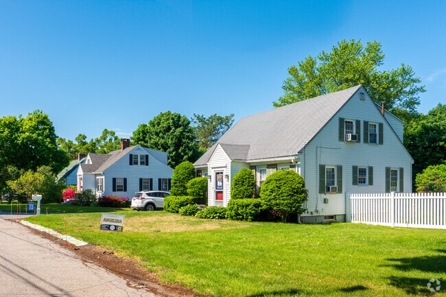 A row of cape cod home participates in Kittery's variety of types of homes.