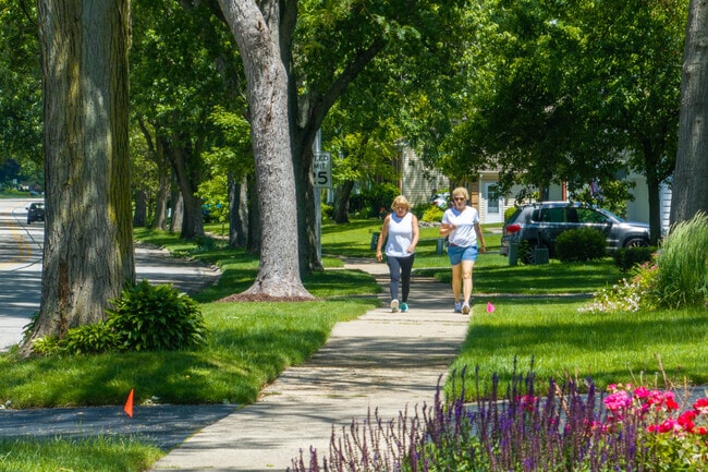 Residents enjoy a walk through the Cress Creek neighborhood.