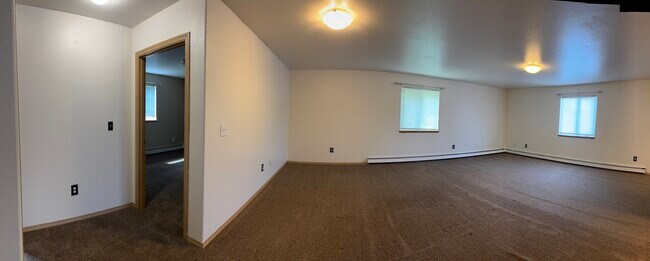 Expansive living room with multiple windows for great natural light.
