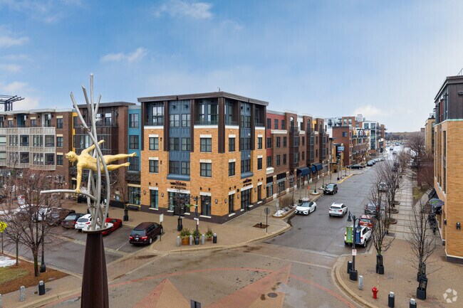 A statue stands tall at the traffic circle in The Town Green
