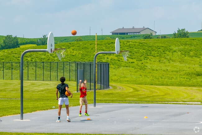 Fayetteville locals head to Norlo Park for a game of basketball.