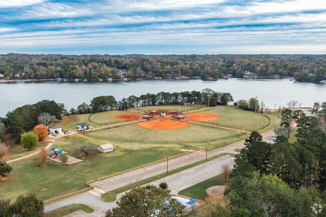 Lake Laurel Park offers various outdoor amenities encompassed by the Lake District's lake.