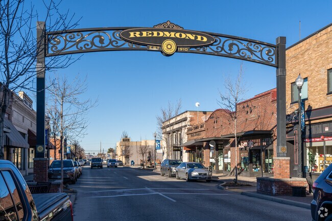 A metal sign downtown dons the city of Redmond's name on it.