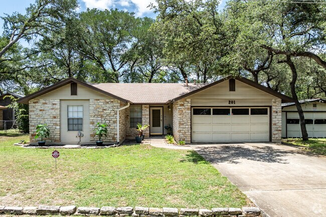 This typical sized ranch-style home has a rock accent in Cedar Park Ranchettes.