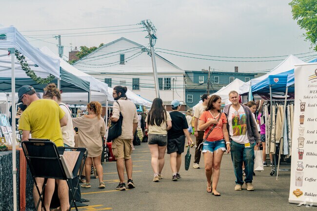 Locals walk around the Bright Bazaar in Saint Elizabeth's to find fun and unique items.