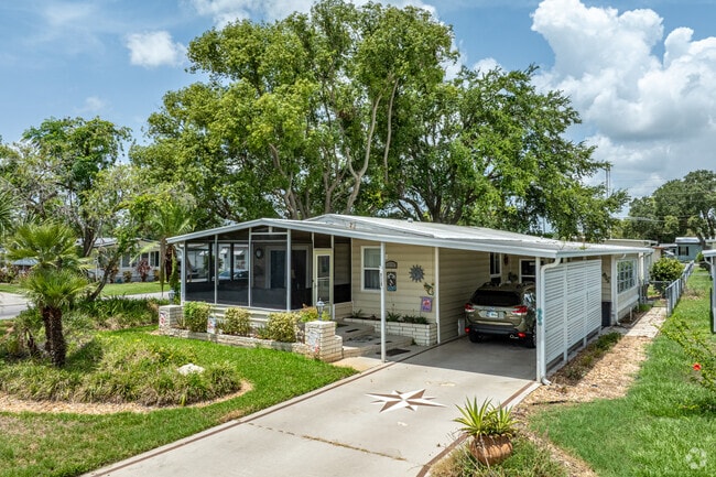 Screened patios and shaded carports add comfort and charm in Zephyrhills West.