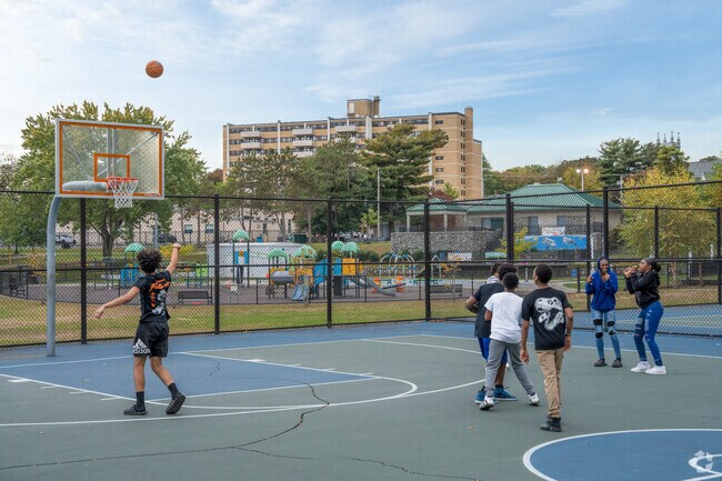 Kids playing basketball in the court at WWII Veterans Memorial State Park.
