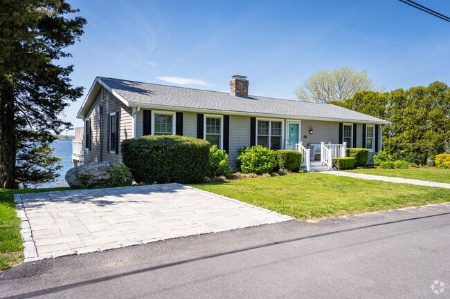 An elegant ranch style home boasting a scenic bay view in the North Tiverton neighborhood, RI.