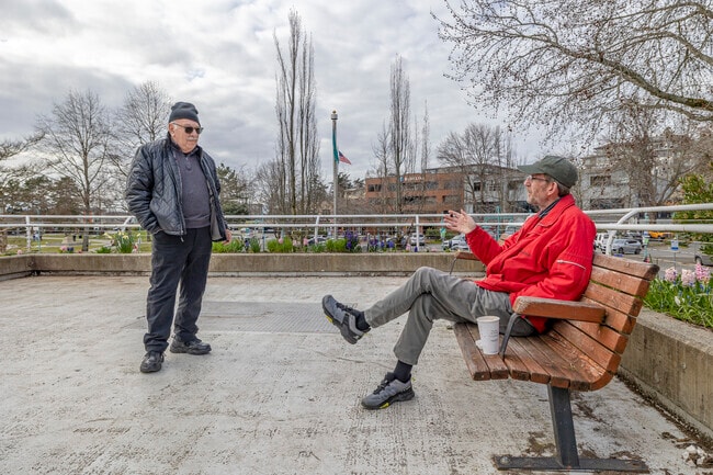 Locals catch up on a cloudy afternoon in Downtown Kirkland.