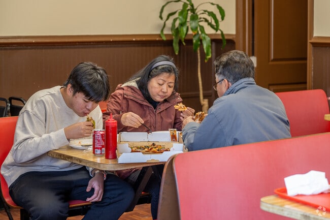 Diners enjoy a pizza at Basil's Pizza on Riggs Rd in Adelphi.