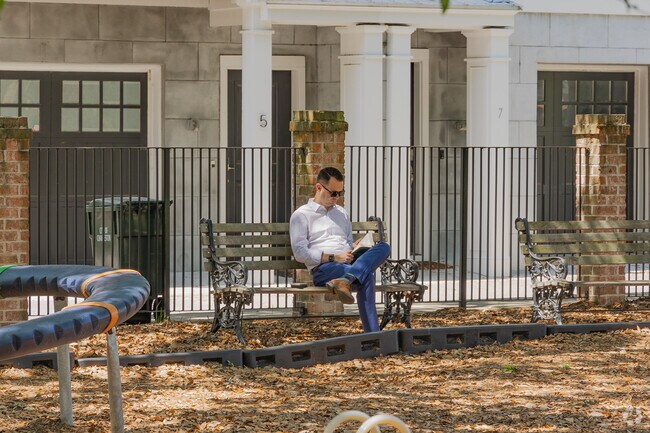 Radcliffeborough locals enjoy relaxing on a shaded bench with a book at DeReef Park.