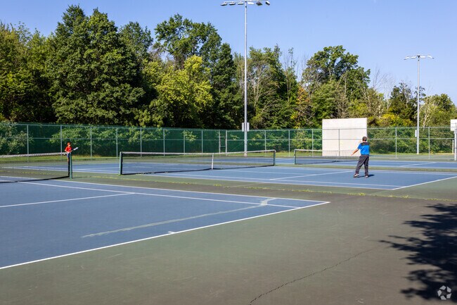 Play tennis at White Oak Park in Branchburg Township.