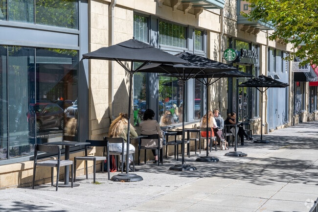 Catholic University students and locals sitting outside of Starbucks on Monroe St NE.