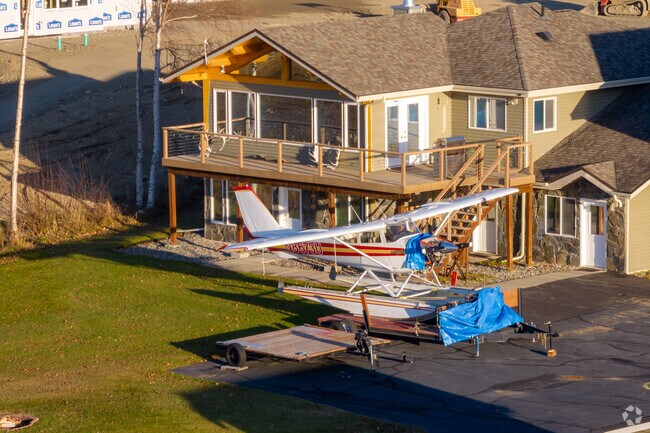 A small plane sits outside this Meadow Lakes home awaiting its next adventure.
