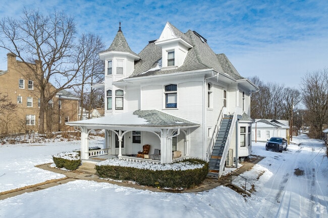 Beautiful Victorian home in Springfield, Ohio features a covered porch and a detached garage.