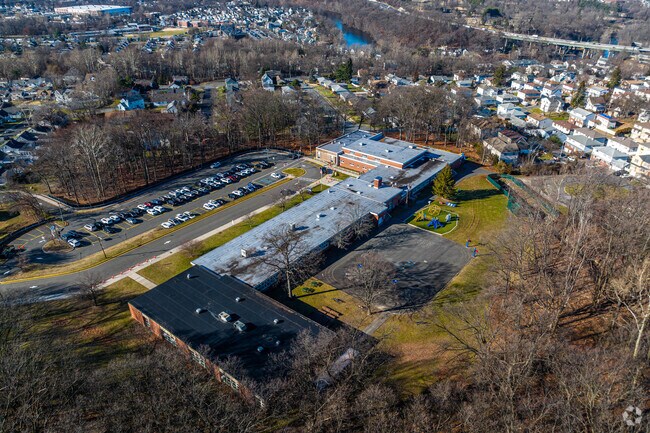 Charles Olbon School is a public K-12 school with a large campus.