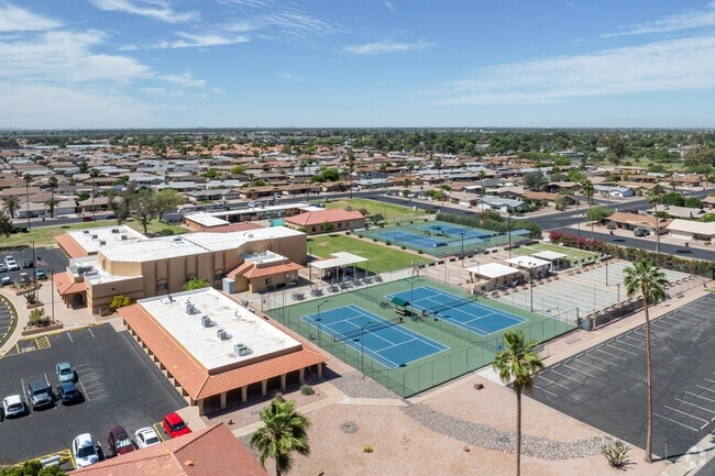 The Sunland Village community promotes an active lifestyle with a recreation center that includes a pool and tennis courts.