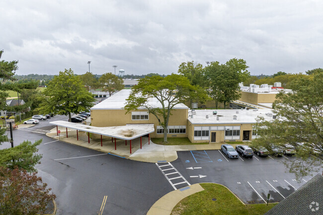 Island Trees High School in Levittown has 716 students in grades 9-12 with a ratio of 11 to 1.