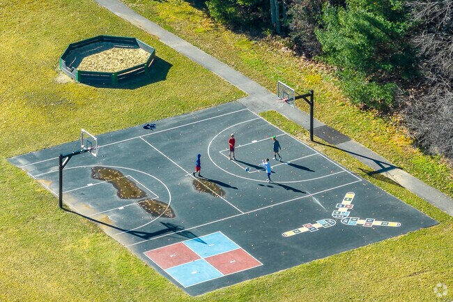 Students play on the basketball court at Mabelle M. Burrell Elementary School in Foxborough, MA.