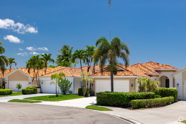 Homes in Village Walk of Naples are built in a Mediterranean style with Spanish-tile roofs.