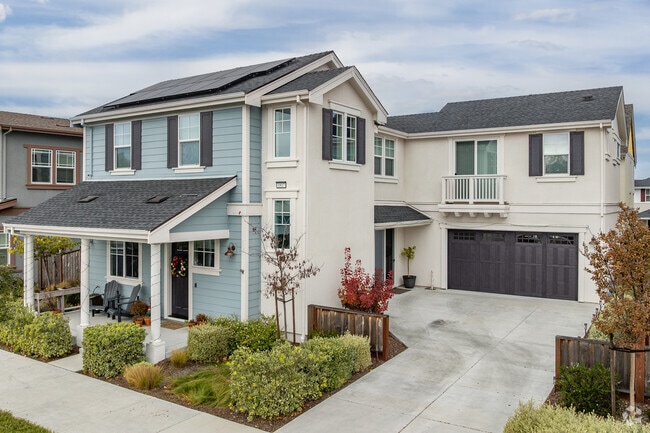 This modern Waterfront home offers a Romeo and Juliet balcony.