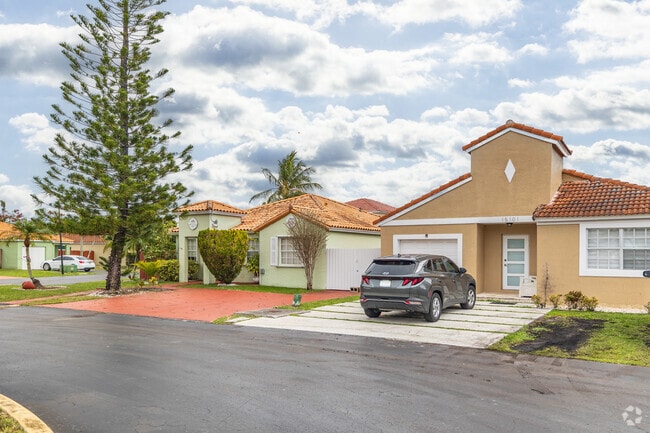 Live in a cozy Spanish-Revival style home in Three Lakes, FL.