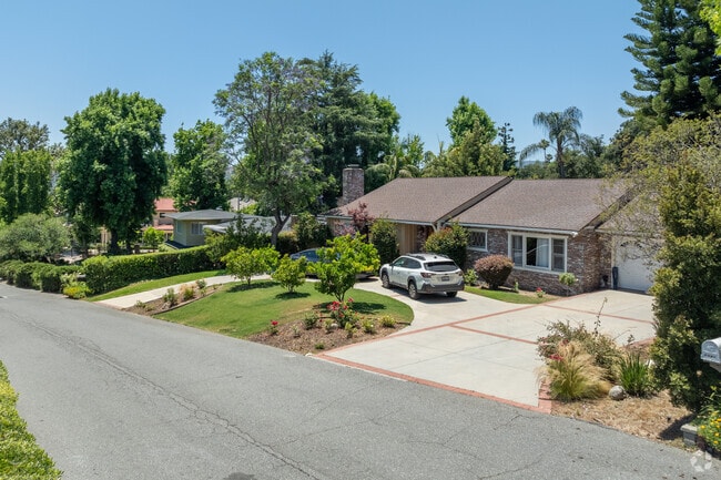 Homes elevate next to each other as the street climbs toward the hills in La Canada Flintridge.