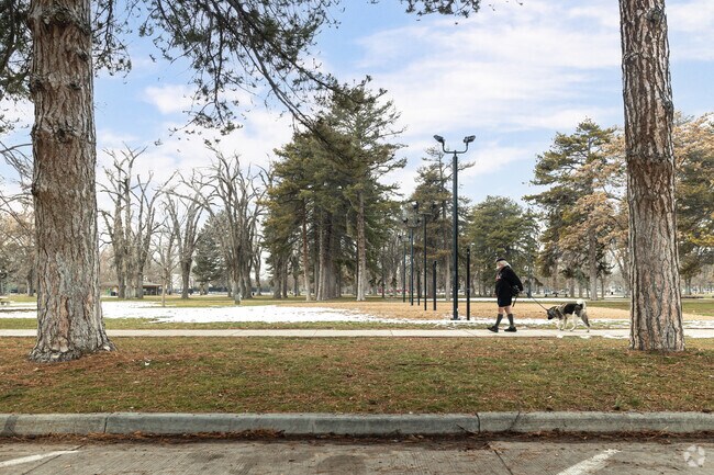 A man walks his dog at Liberty Park in East Central.