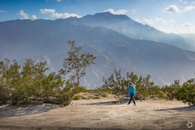 The resident enjoys an afternoon walk in the mountainsides of Desert Edge.