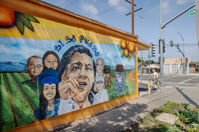 Colorful mural painted on the side of a neighborhood market located in Santa Anita Park.
