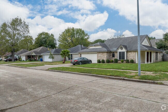 A row of homes, found on a quiet, rural street outside of Highlands, Texas.
