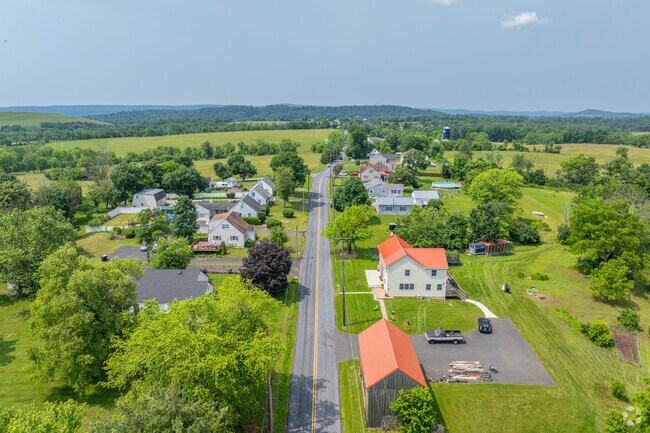 County roads pass through forested rolling hills in Douglass.