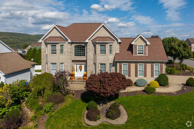 Large Colonial Revivals are nestled on hills in Duryea boasting strong curb appeal.