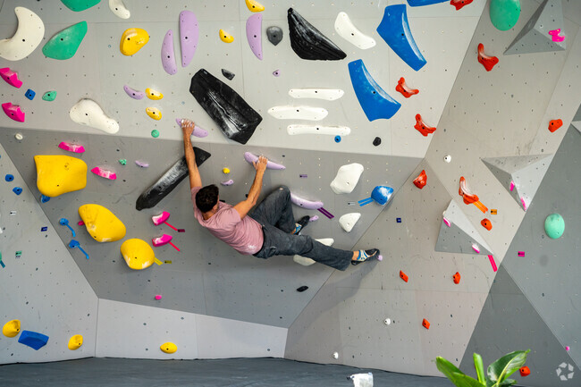 Conquer an advanced route in Fair Haven at the Ascent Climbing Gym.