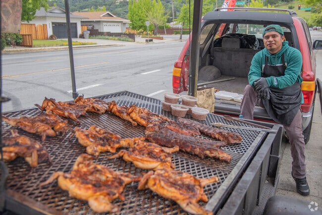 Street Vendors sometimes can be found around the neighborhood selling freshly grilled meats like La Polliza's Pollos Asados ,