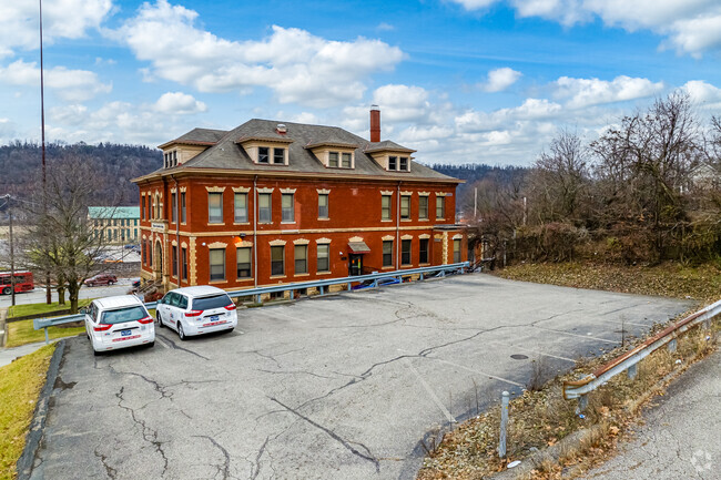 Park in the Virtuous Academy lot and come in to school.