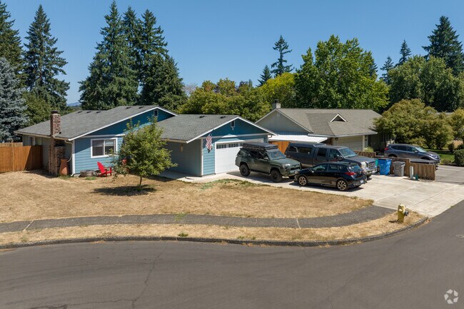 Burnt Bridge Creek features ranch homes and cul-de-sacs shaded by fir trees.