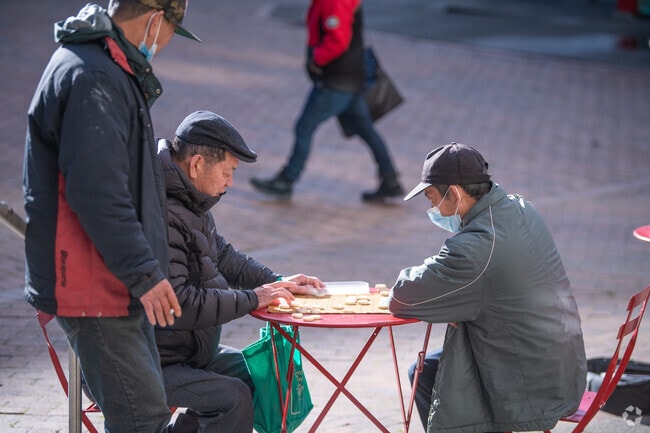 Play games at the park with the locals in Chinatown-International District.