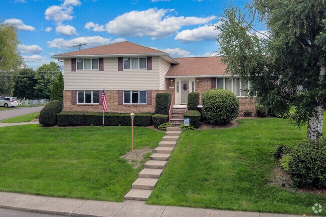 A classic split-level home set back from the street offers privacy in Jessup, PA.