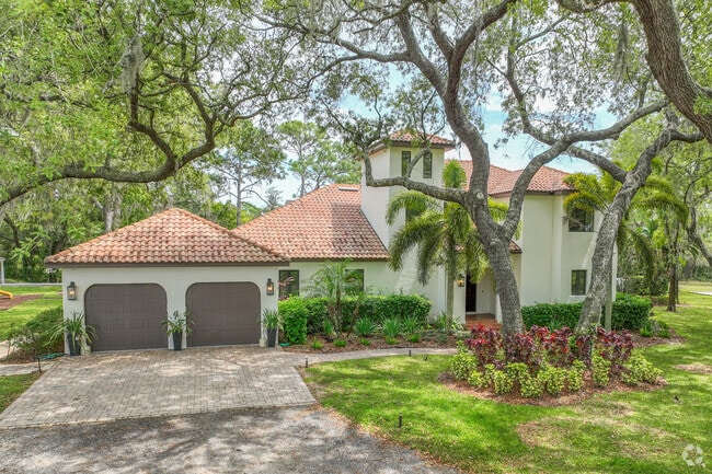 Mediterranean estates sit behind gates in Citrus Park.