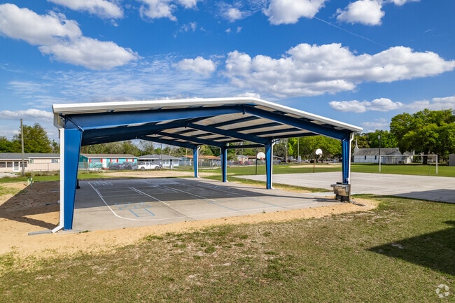 Kids love playing hoops on the basketball courts at Groveland Elementary School.